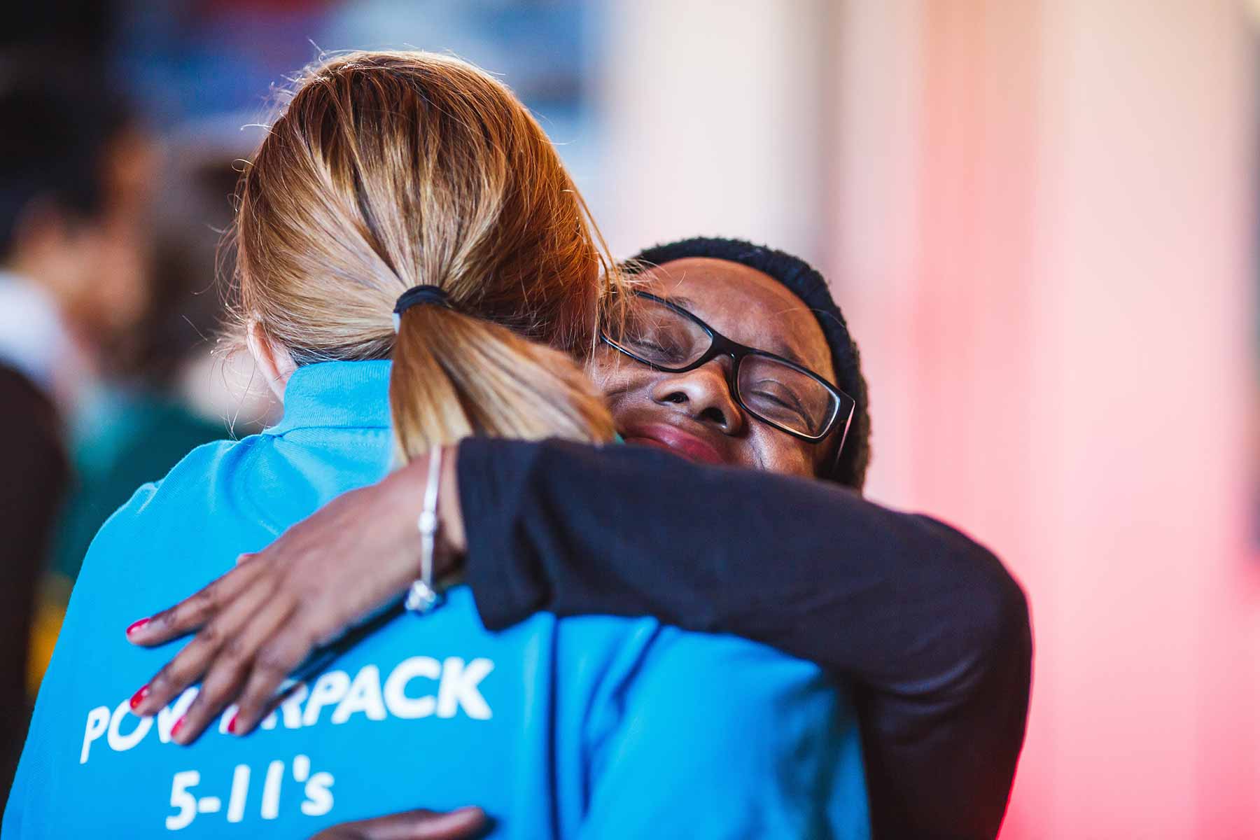 Two female church members of Bethany Community Church hugging