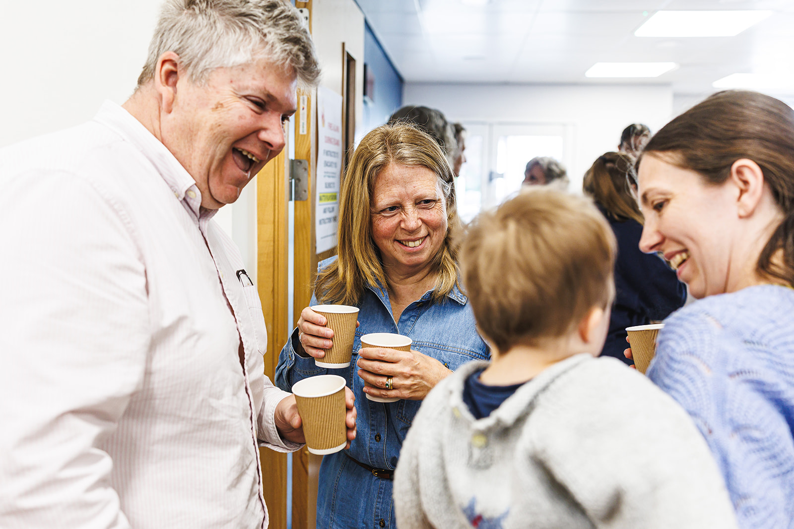 Friends sharing a cup of tea and a laugh after a Bethany Sunday gathering