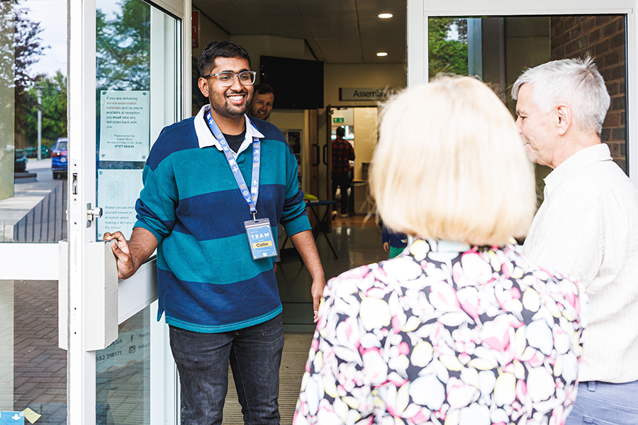 A member of the Welcome Team wearing a lanyard